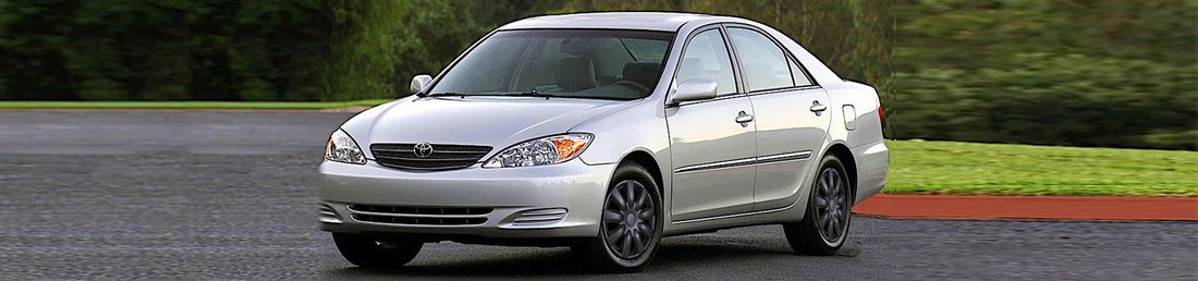 2006 Toyota Camry with stylish matte black 15 inch WINJET hubcaps on wheels