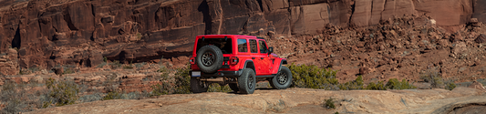 Smoked LED tail lights installed on 2024 Jeep Wrangler JLU off-road view